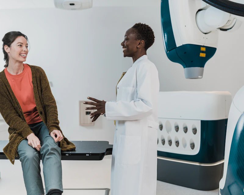 Doctor talking with a smiling patient