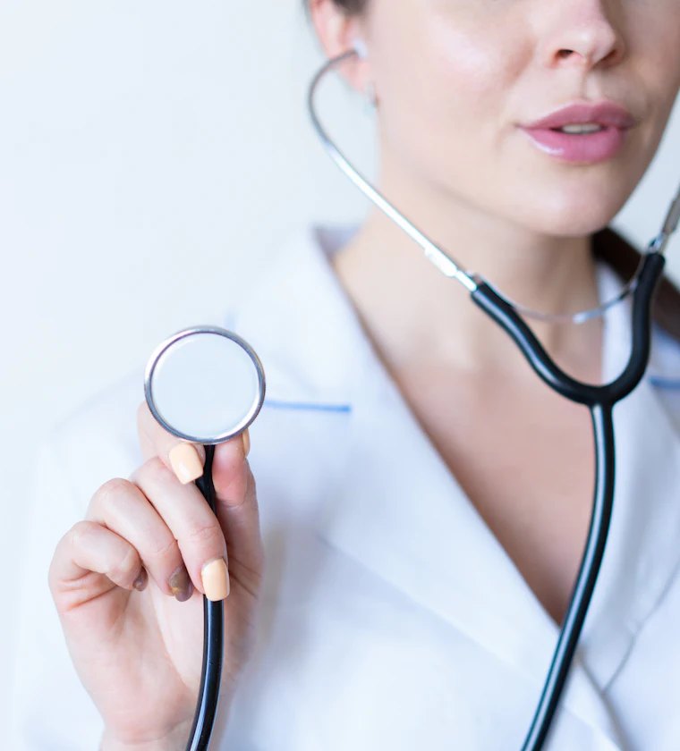 Doctor holding a stethoscope at Base Health Hub